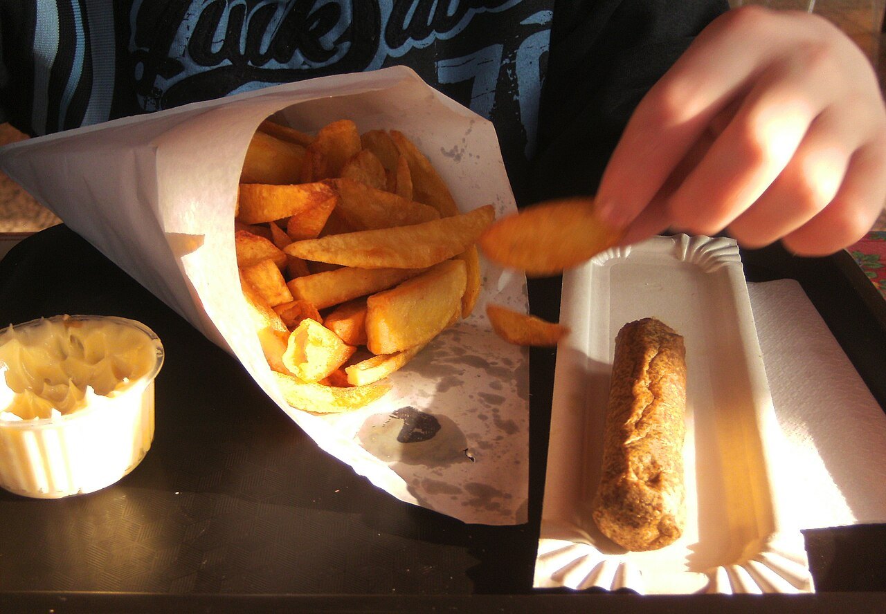 Belgian frites in a paper cone with mayonnaise