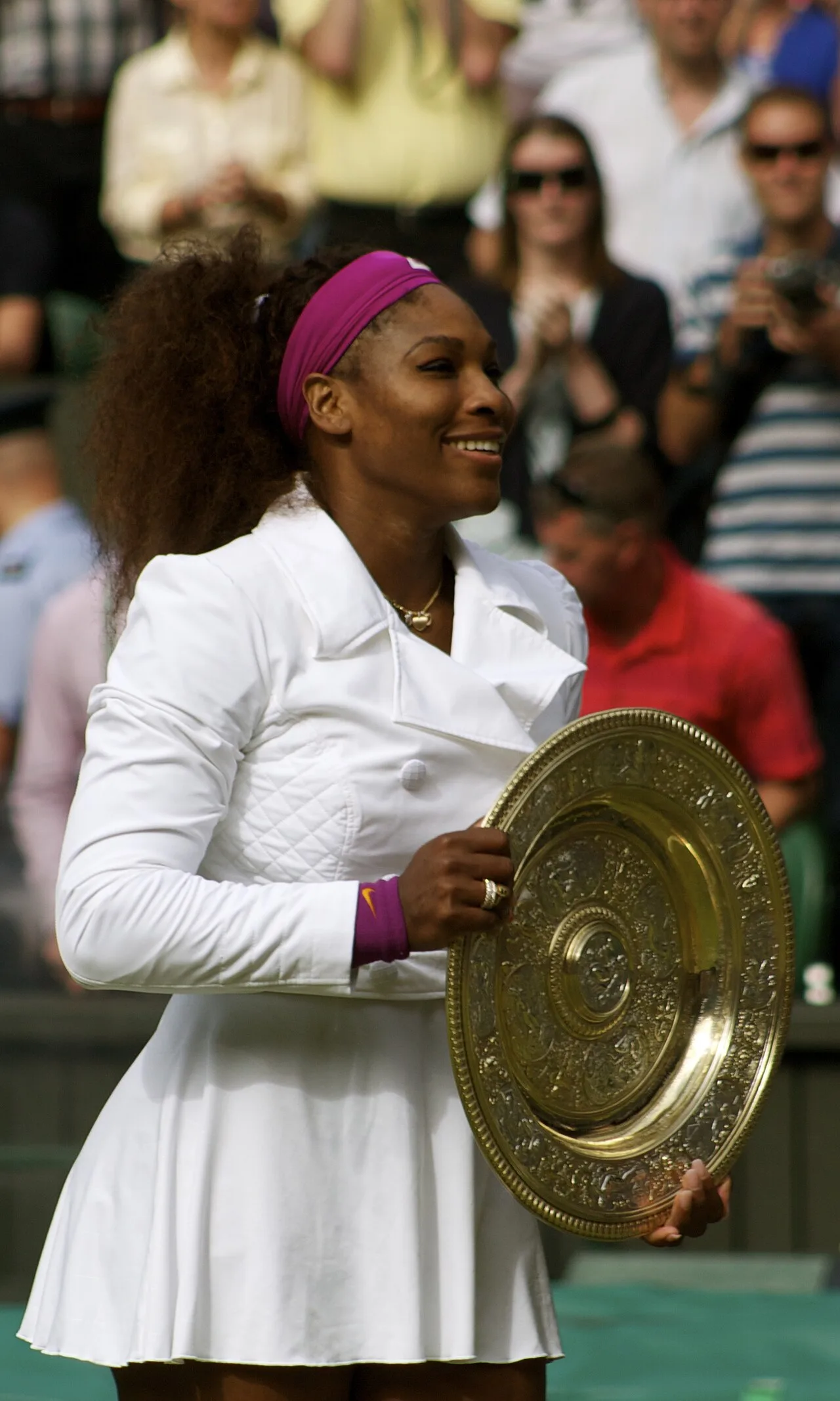 Serena Williams holding the Venus Rosewater Dish after winning Wimbledon in 2012